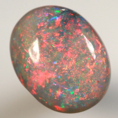 SOLID BLACK OPAL Top quality. Filled with bright red fire, high dome.  SEE VIDEO